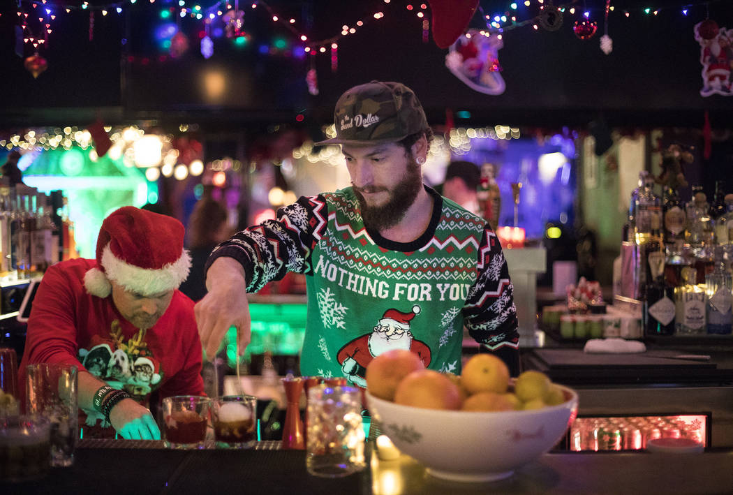 Bartenders Clint "Spotty" Spotleson, left, and Bryan Pierzga, right, mix drinks at th ...