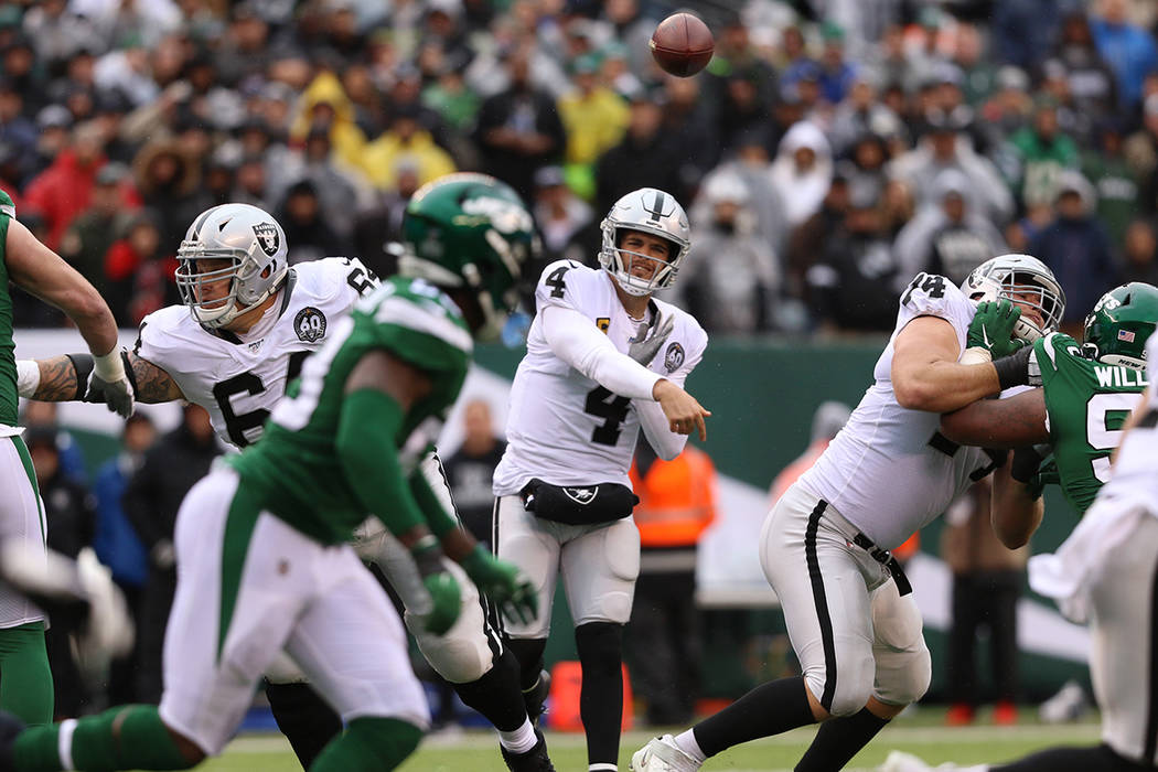 Oakland Raiders quarterback Derek Carr (4) throws the football during the first half of an NFL ...