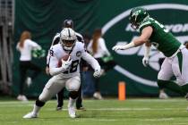 Oakland Raiders running back Josh Jacobs (28) runs with the football as New York Jets defensive ...