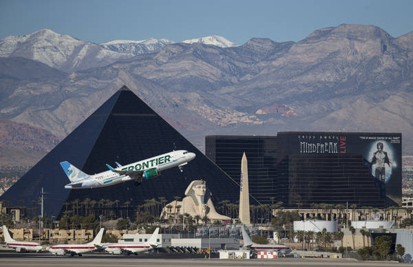 A Frontier Airlines flight departs McCarran International Airport in Las Vegas, Sunday, January ...