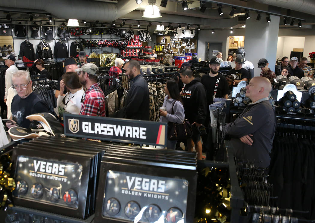 Black Friday sale shoppers lined up to check out at the Arsenal retail store at the City Nation ...