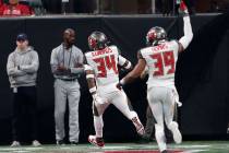 Tampa Bay Buccaneers safety Mike Edwards (34) runs into the end zone for a touchdown against th ...