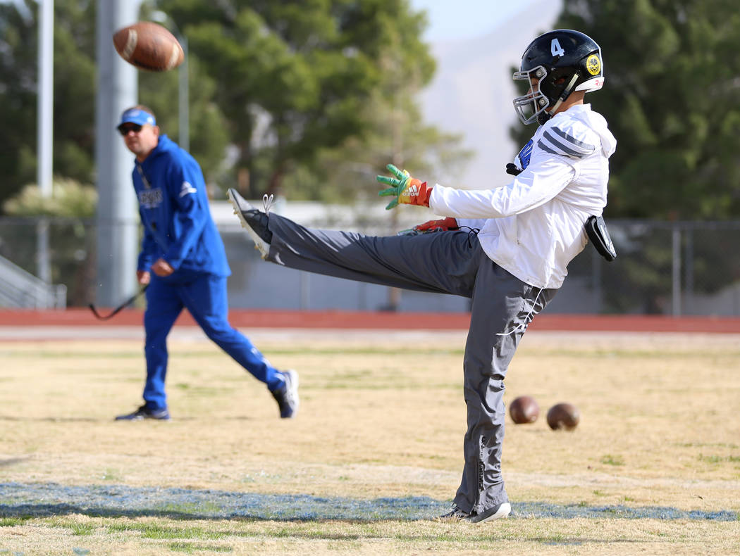 Desert Pines' Branden Thomas (4) punts the ball during a team practice at Desert Pines High Sch ...