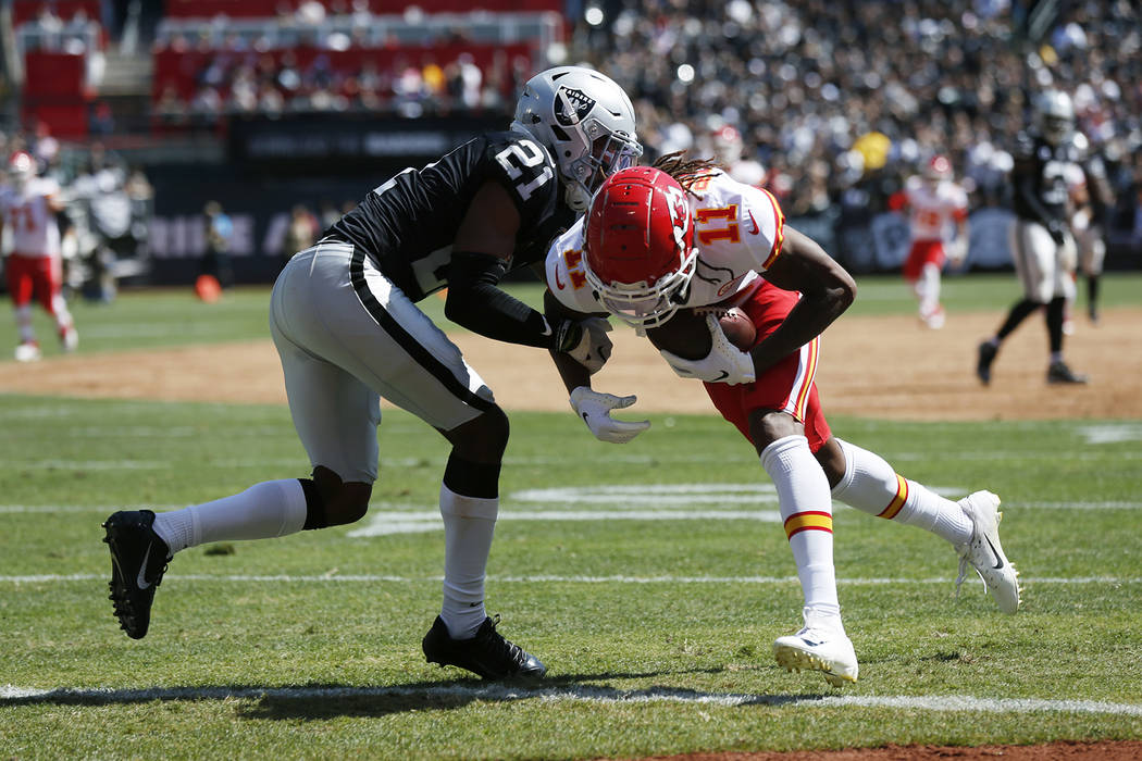 Kansas City Chiefs wide receiver Demarcus Robinson (11) scores a touchdown as Oakland Raiders c ...
