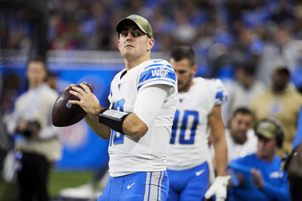 Detroit Lions quarterback David Blough (10) warms up against the Dallas Cowboys during an NFL f ...