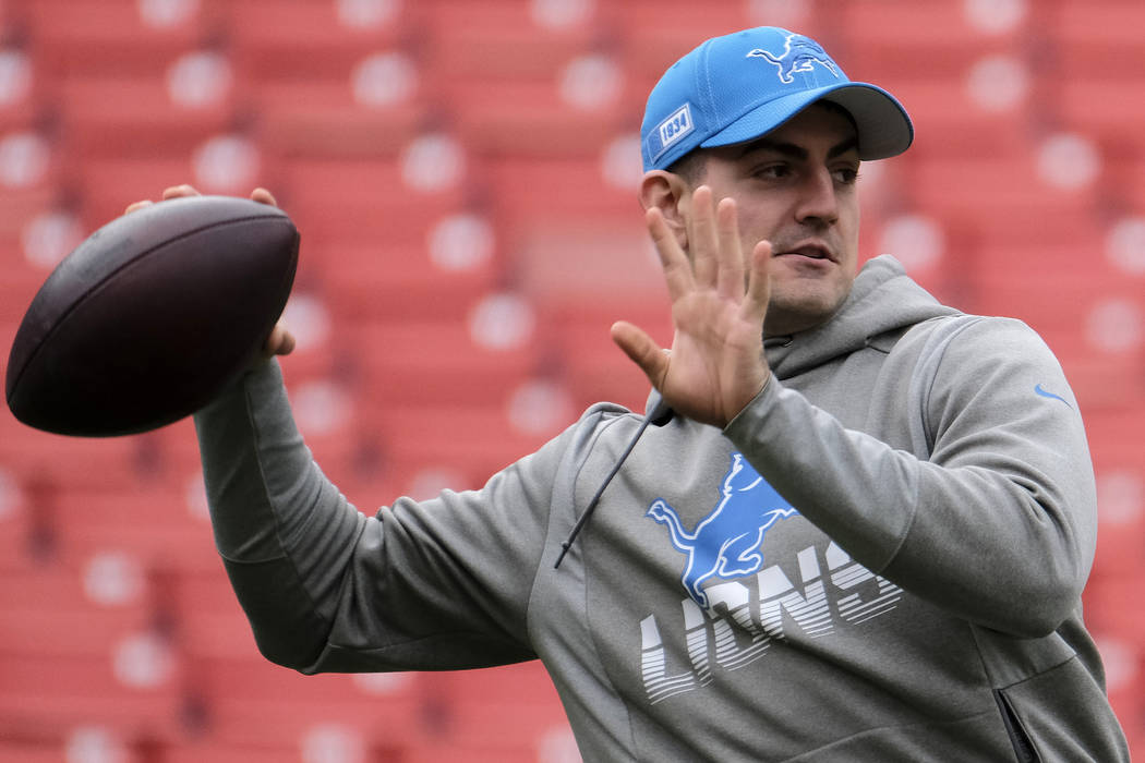 Detroit Lions quarterback David Blough warms up prior to an NFL football game between the Detro ...