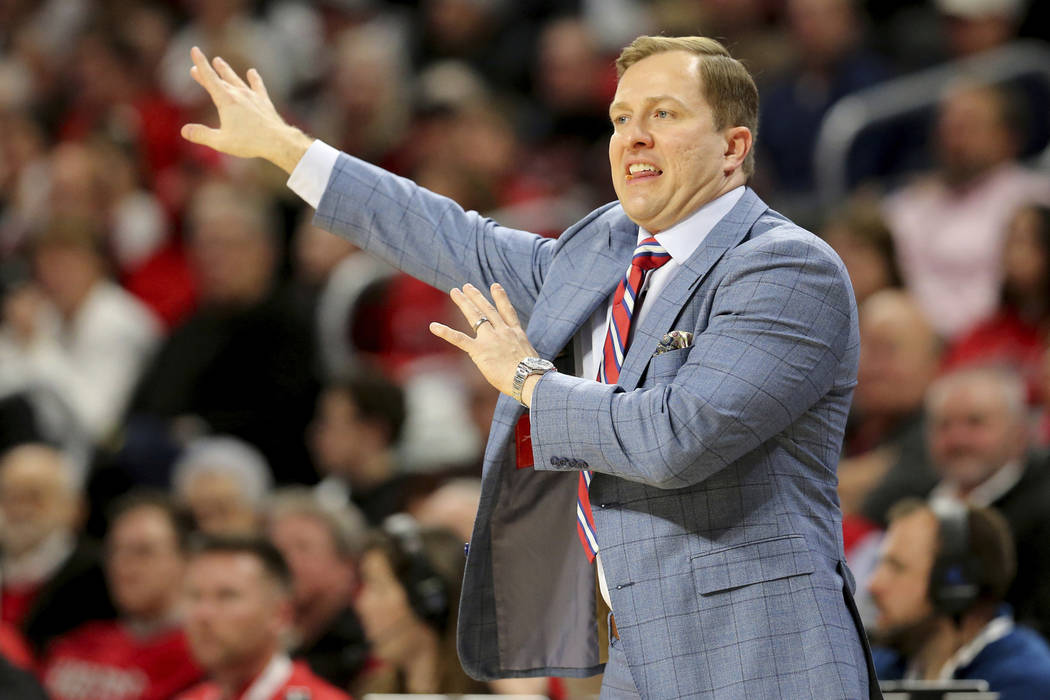 UNLV coach T.J. Otzelberger gestures during the first half of the team's NCAA college basketbal ...