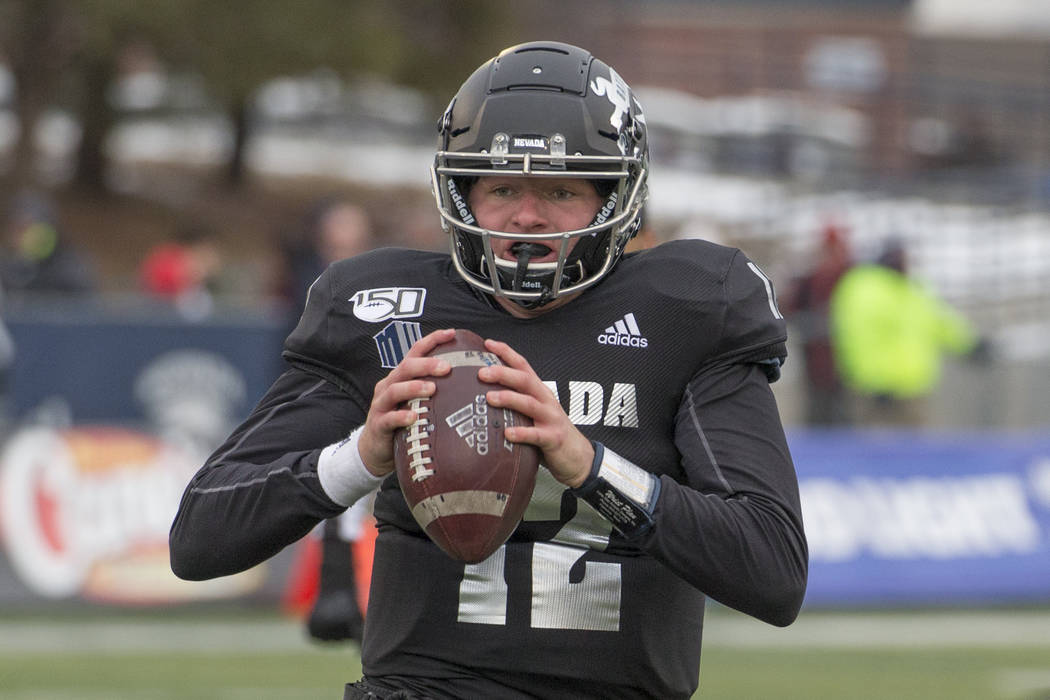 Nevada quarterback Carson Strong (12) looks to throw against UNLV second half of an NCAA colleg ...