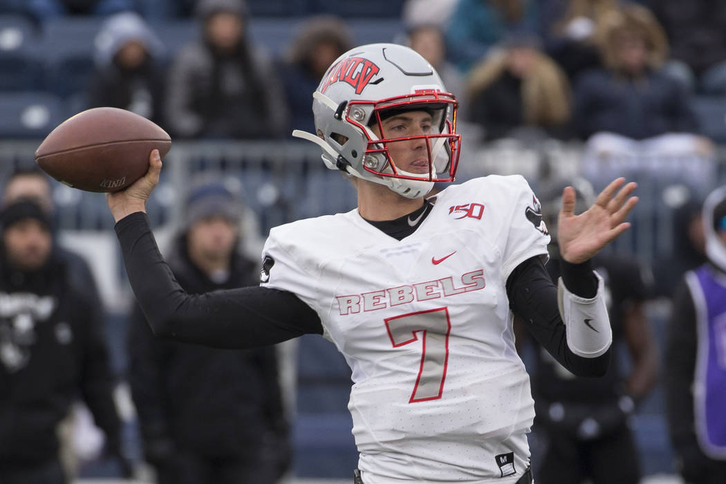 UNLV quarterback Kenyon Oblad (7) throw against Nevada in the second half of an NCAA college fo ...