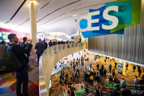 CES attendees make their way to the Sands Expo and Convention Center in Las Vegas on Wednesday, ...
