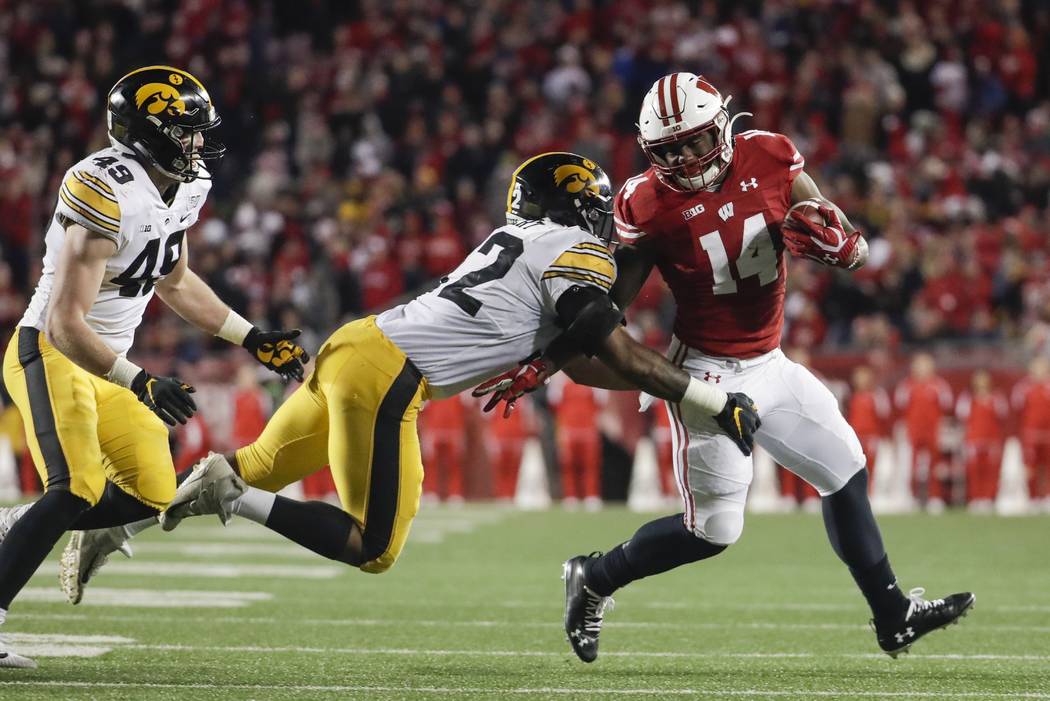 Wisconsin's Nakia Watson tries to get past Iowa's Djimon Colbert during the second half of an N ...