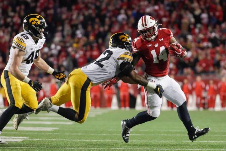 Wisconsin's Nakia Watson tries to get past Iowa's Djimon Colbert during the second half of an N ...