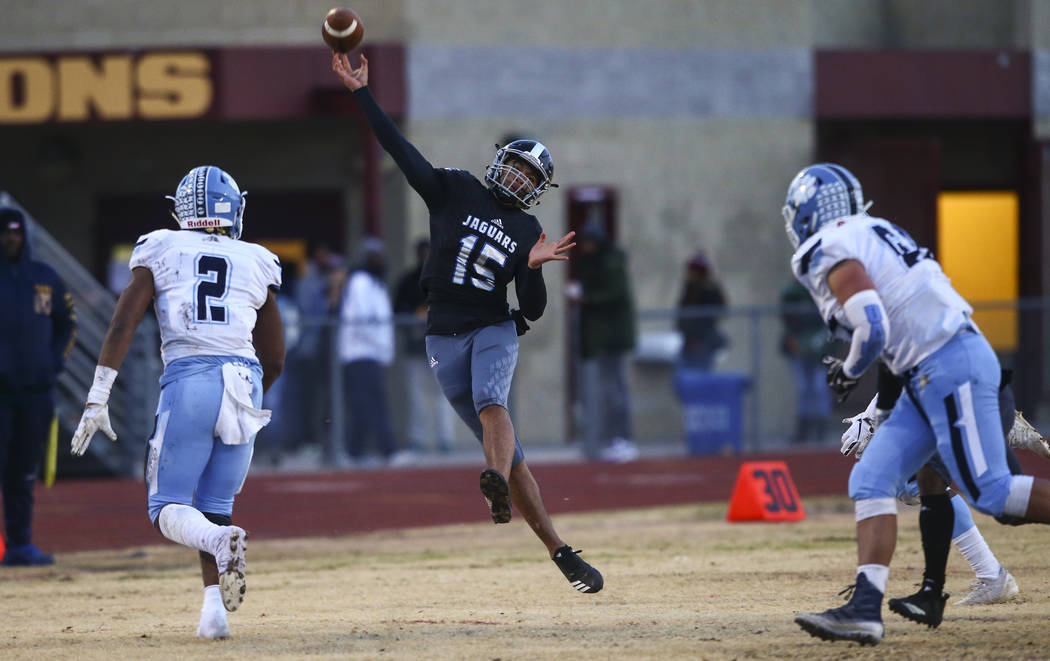 Desert Pines' Rjay Tagataese (15) throws a pass during the first half of a Class 4A football st ...
