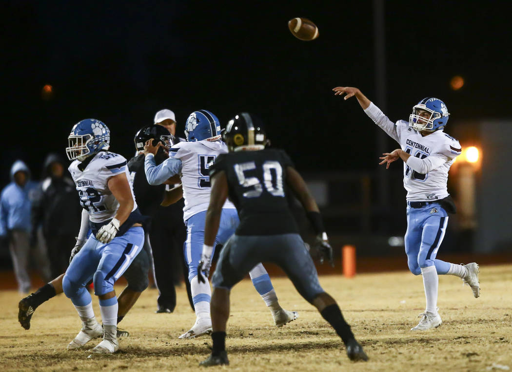 Centennial's Colton Tenney (10) throws a pass during the first half of a Class 4A football stat ...