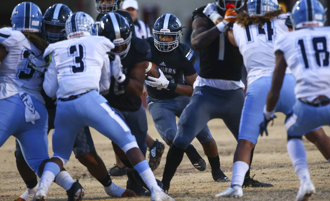 Desert Pines' Malik Brooks (10) runs the ball against Centennial during the first half of a Cla ...