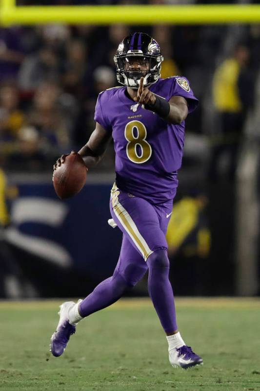 Baltimore Ravens quarterback Lamar Jackson runs against the Los Angeles Rams during the second ...
