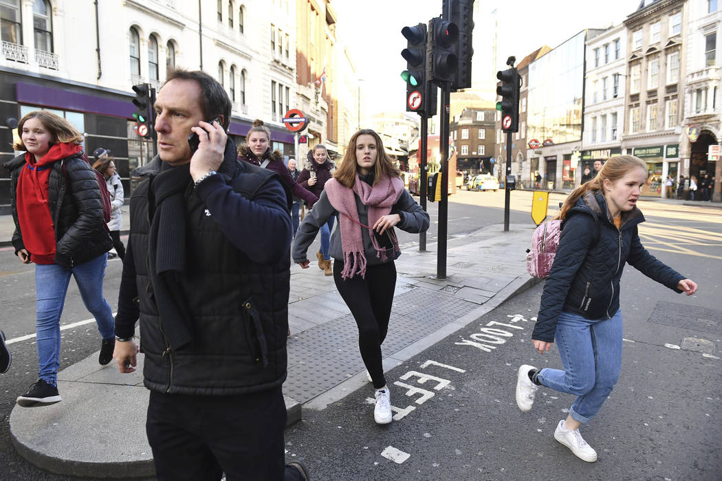 People are evacuated from near London Bridge in central London following a police incident, Fri ...