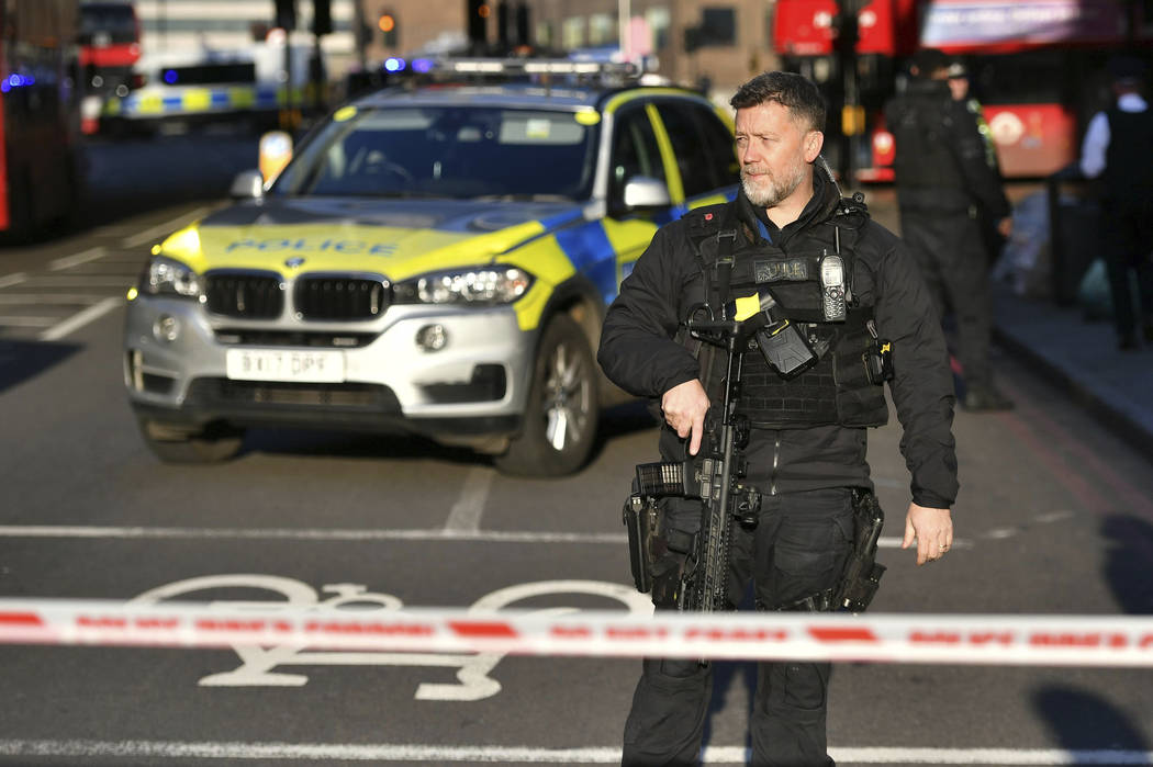 Police at the scene of an incident on London Bridge in central London following a police incide ...