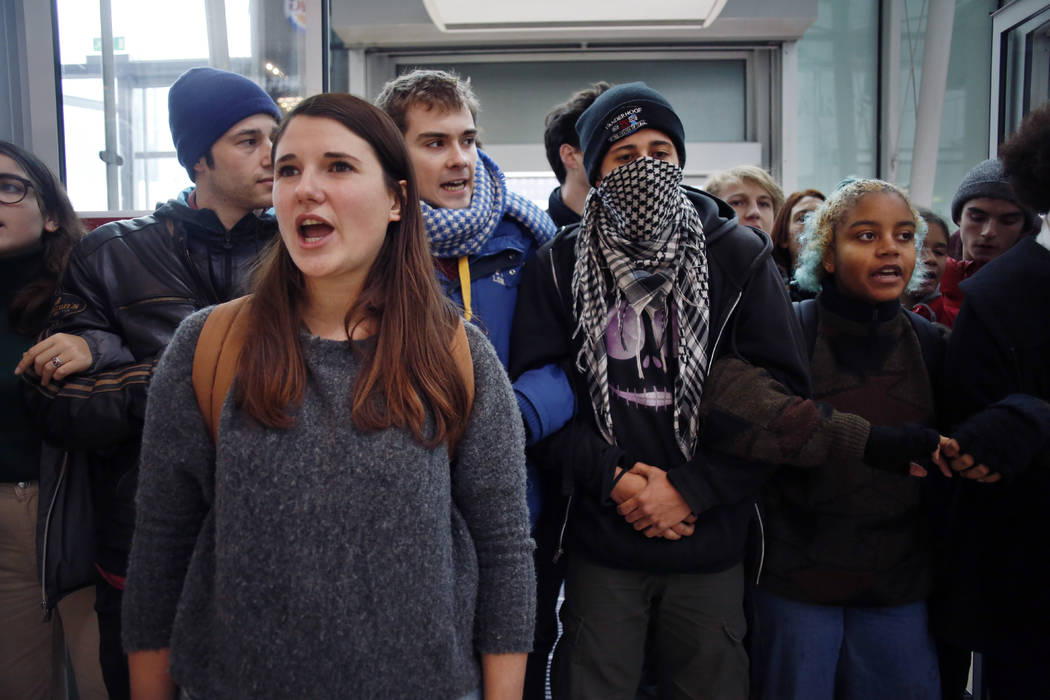 Activists block a shopping center, in the business district of Paris, La Défense, in Paris ...