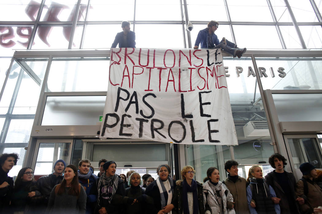 Activists block a shopping center, in the business district of Paris, La Défense, in Paris ...