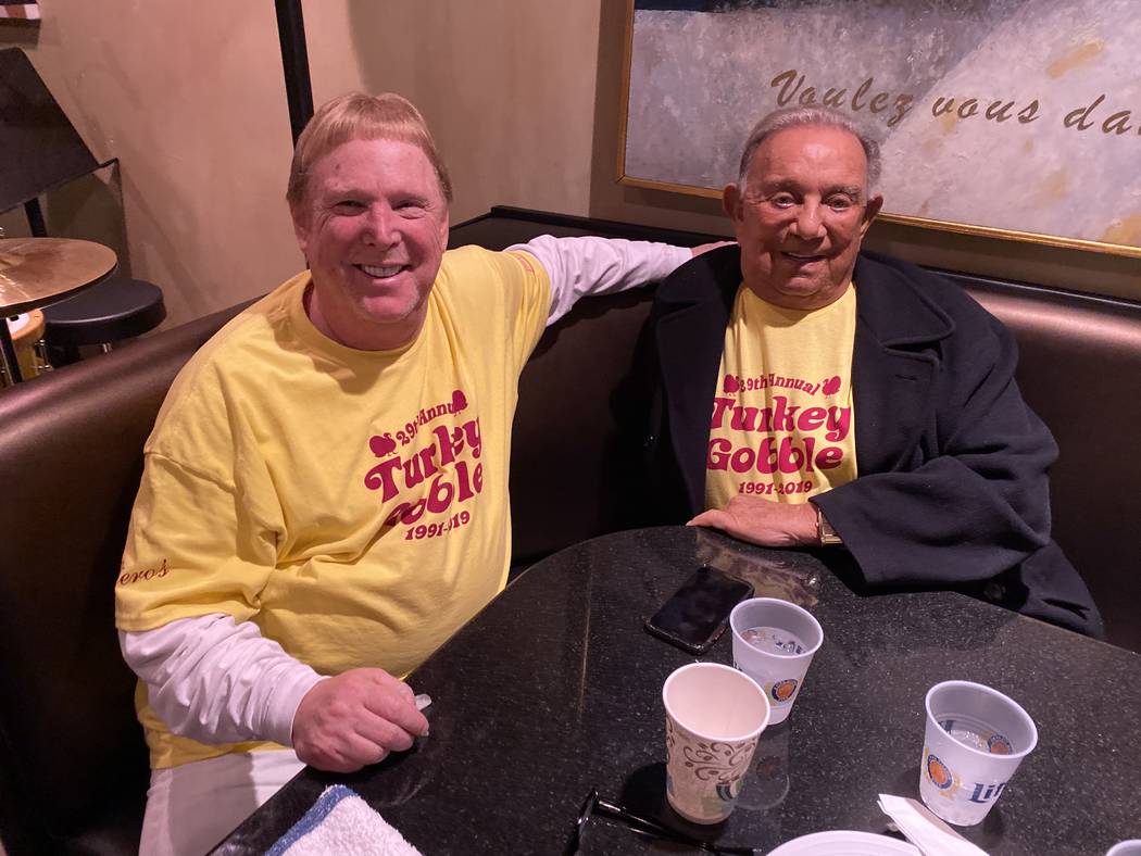Raiders owner Mark Davis, left, with Piero's Italian Restaurant owner Freddie Glusman, during a ...