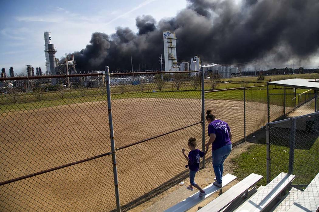 Cloud of smoke in the background from the TPC Group Port Neches Operations explosion is visible ...