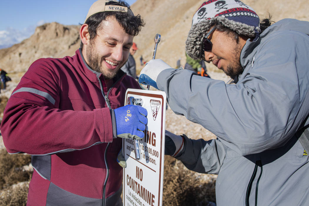 Volunteers for Get Outdoors Nevada Dillon Battaglia, left, of Paradise, Calif., and Carlos Ojit ...