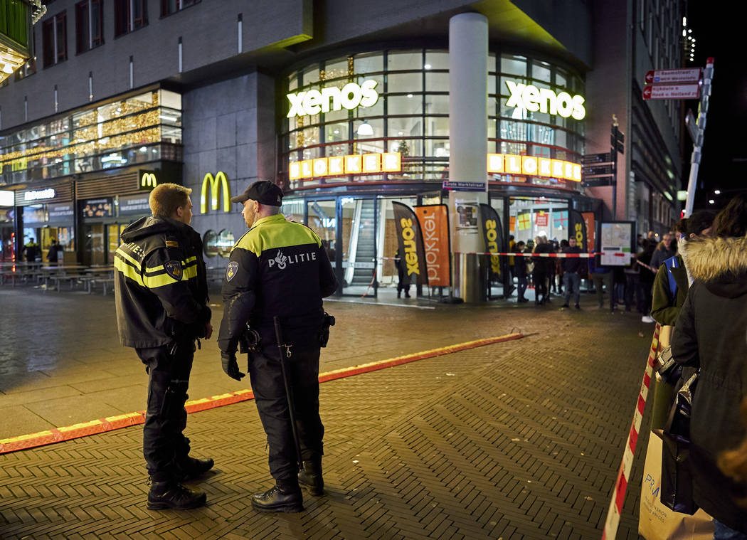 Dutch police secure a shopping street after a stabbing incident in the center of The Hague, Net ...