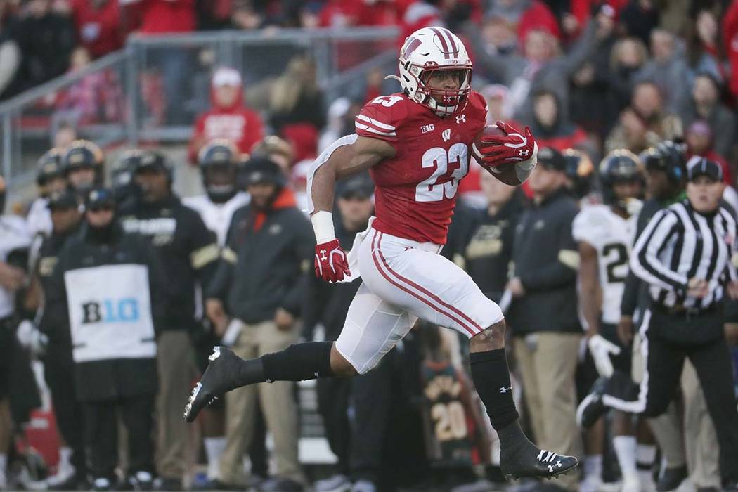 Wisconsin's Jonathan Taylor runs for a touchdown during the first half of an NCAA college footb ...