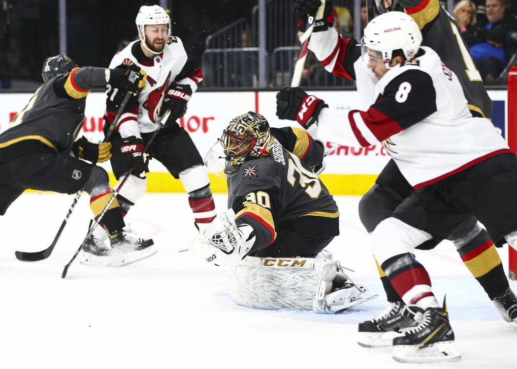 Golden Knights goaltender Malcolm Subban (30) stops the puck in front of Arizona Coyotes' Nick ...