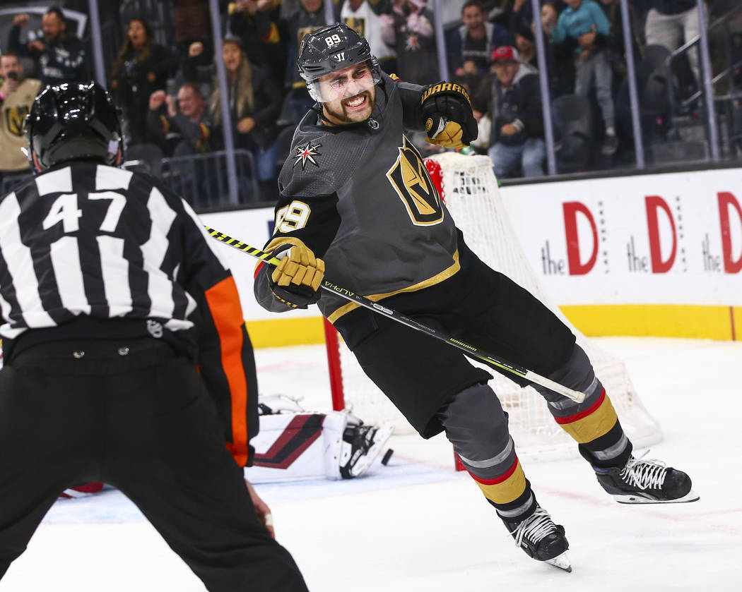 Golden Knights' Alex Tuch (89) celebrates after scoring in a shootout to win the game against t ...