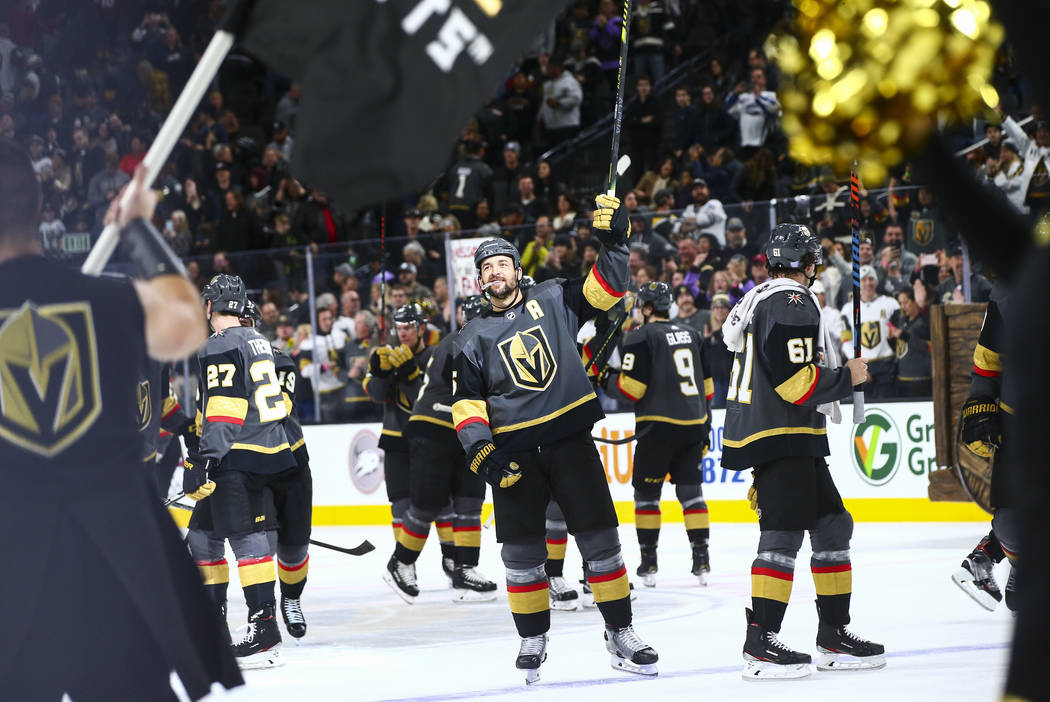 The Golden Knights, including Deryk Engelland, center, celebrate after a shootout win over the ...