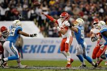 Kansas City Chiefs quarterback Patrick Mahomes throws a pass under pressure from Los Angeles Ch ...
