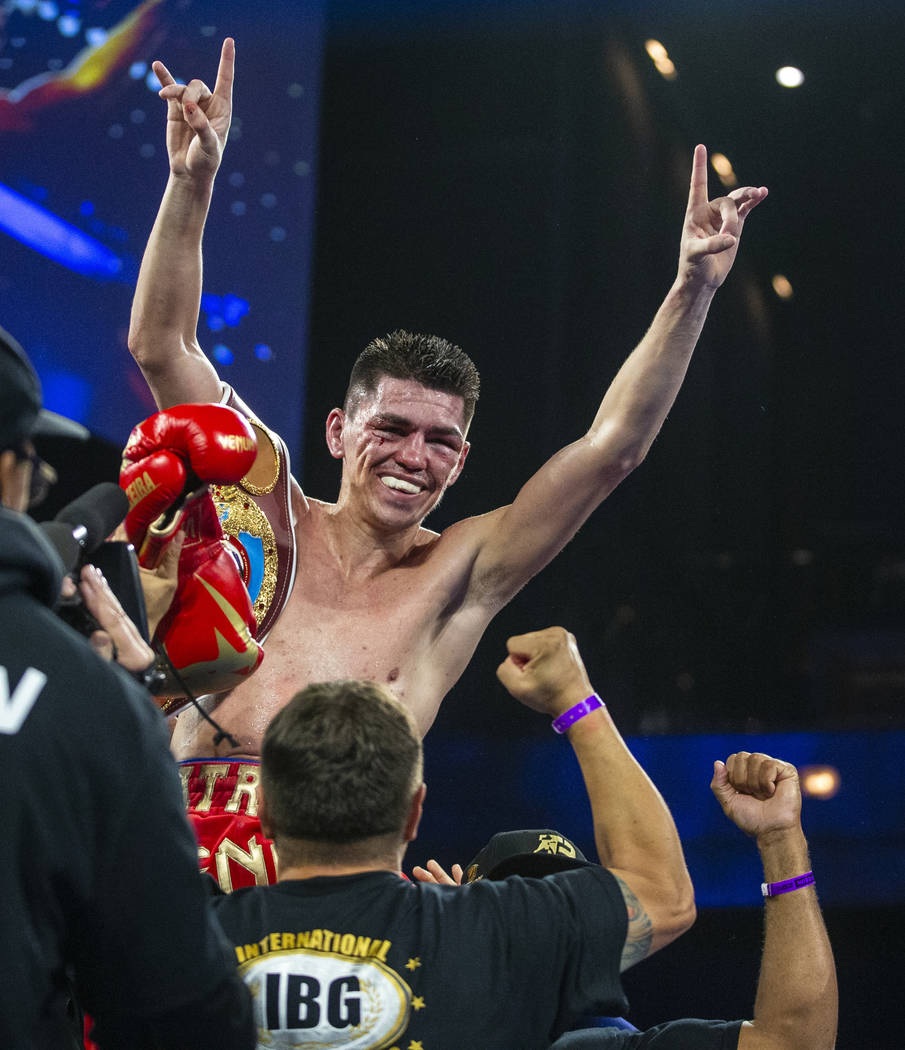 Patrick Teixeira celebrates his win over Carlos Adames following their super welterweight fight ...