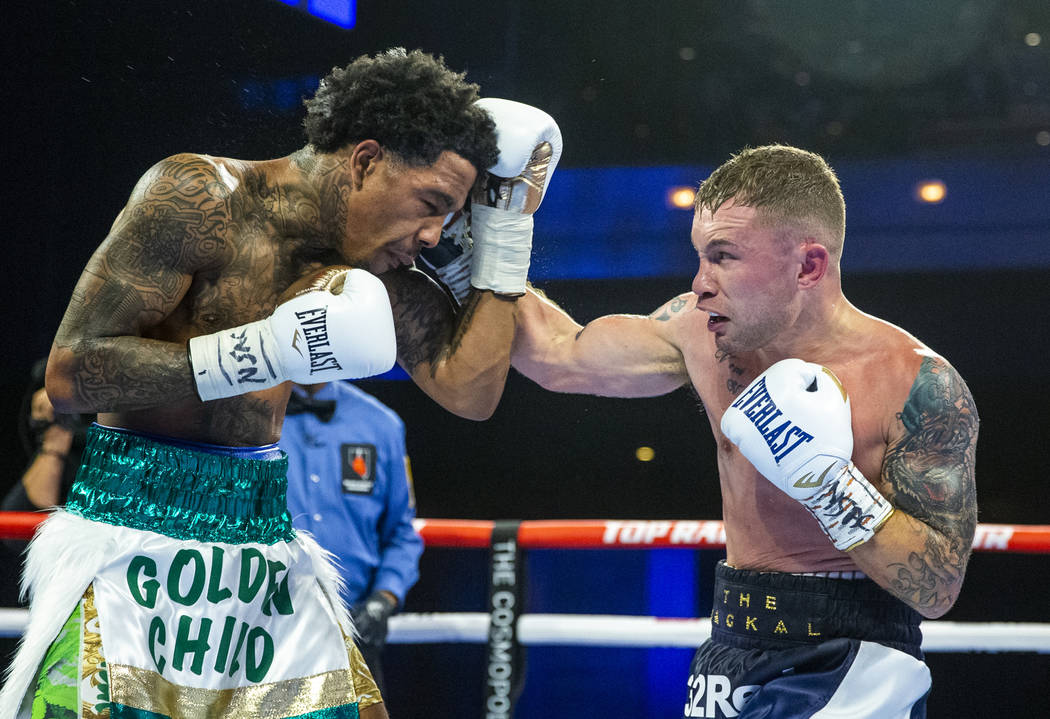 Tyler McCreary, left, takes a punch to the chin from Carl Frampton during round 6 of their WBC ...
