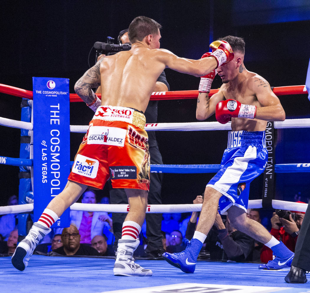 Oscar Valdez, left, sends the final punch to the head of Adam Lopez during round 7 of their WBC ...
