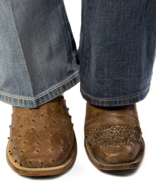 Seniors Jordan Siminoe, left, and Kendra Cates of the UNLV rodeo team show of their cowboy boot ...