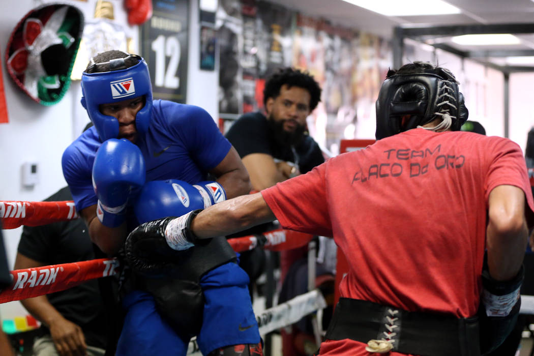 Boxer Devin Haney, left, defends a punch against Cesar Valenzuela while sparring in preparation ...