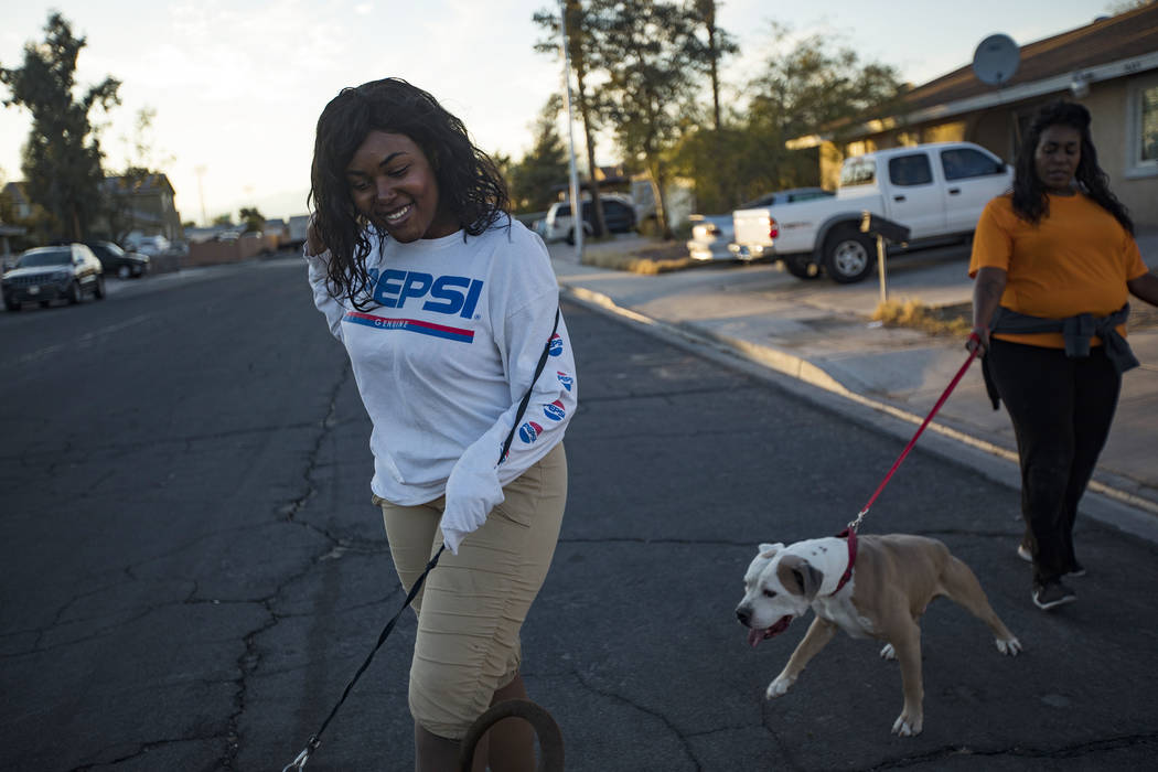 JennŽ Lewis, left, walks her dog with her mother Connie Lewis near their home in Las Vega ...