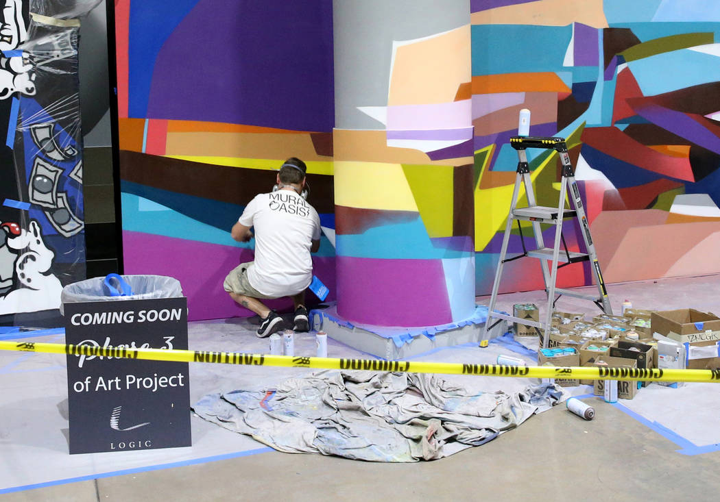 Murals in progress at Fashion Outlets of Las Vegas in Primm as the outlet mall is rebranded to ...