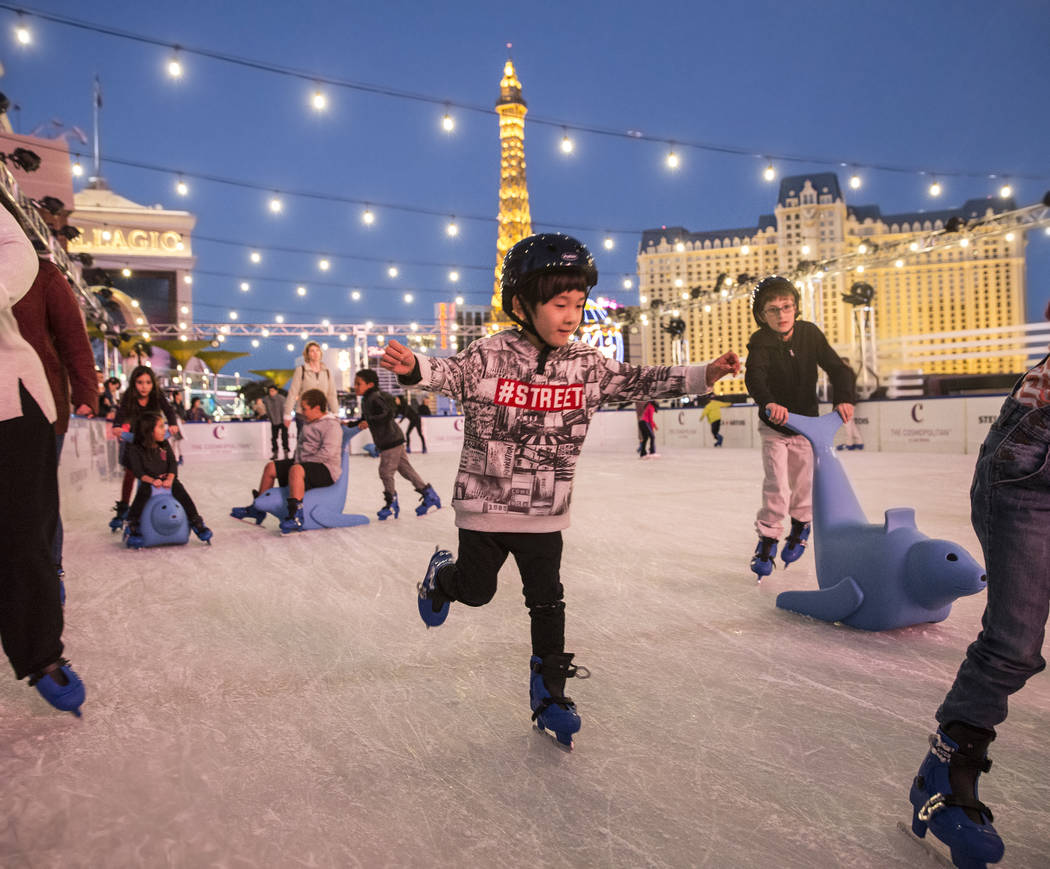 Skaters enjoy the last moments of light at dusk at the Cosmopolitan of Las Vegas Ice Rink on Mo ...