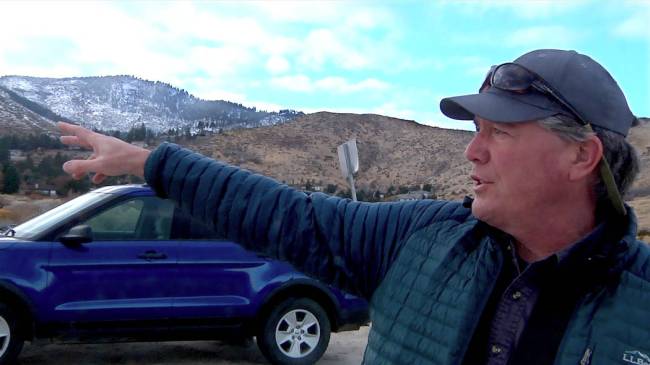 Charlie Donohue, Administrator for the Nevada Division of State Lands, points out a parcel of s ...