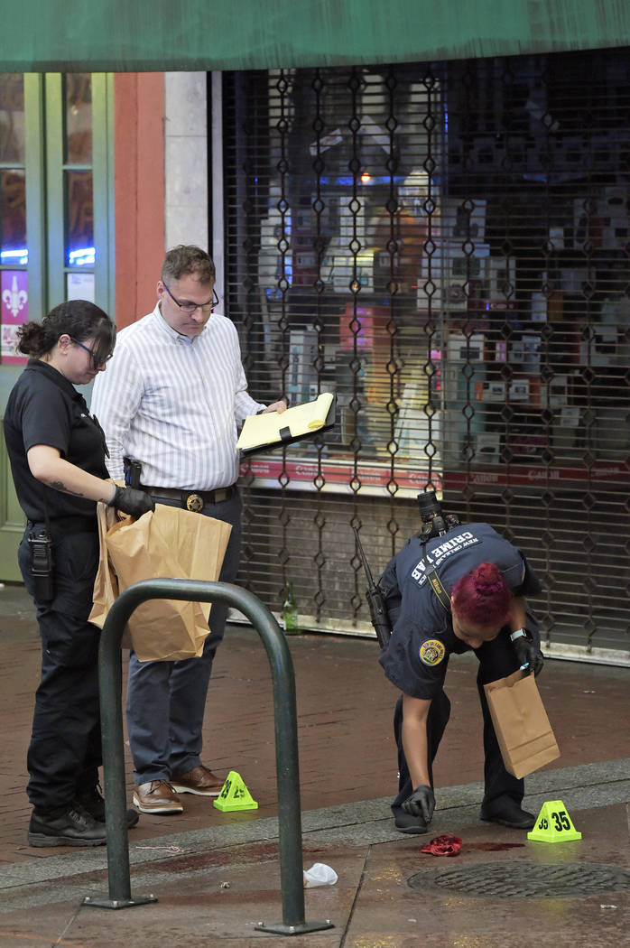 New Orleans police investigate the scene of a shooting Sunday, Dec. 1, 2019, on the edge of the ...