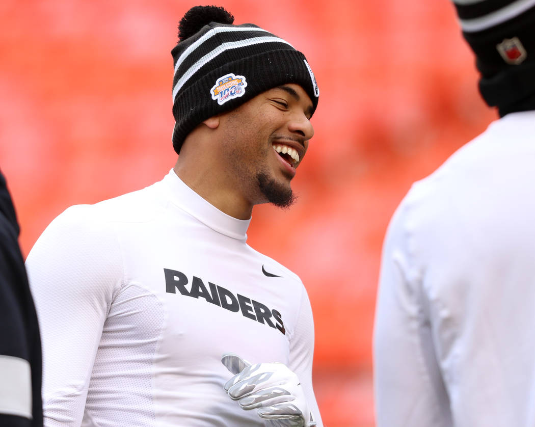 Oakland Raiders wide receiver Keelan Doss meets with teammates on the field prior to an NFL gam ...