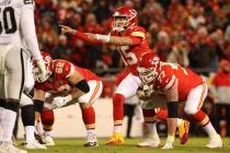 Kansas City Chiefs quarterback Patrick Mahomes (15) calls an audible at the line of scrimmage d ...