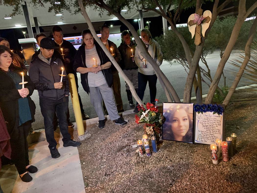 Friends and family gathered outside of a 7-Eleven in southwest Las Vegas on Sunday evening to h ...