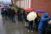 People line up to enter JCPenny at Meadows Mall in Las Vegas for early Black Friday deals on Th ...