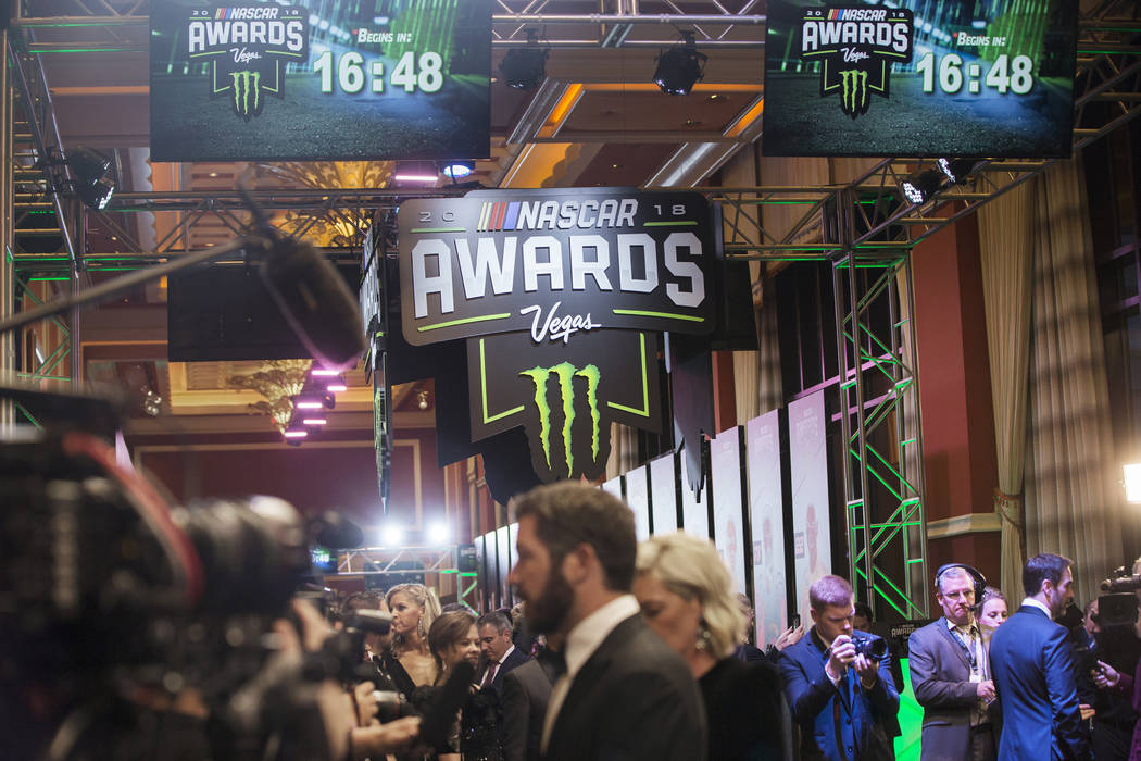 Drivers take photos during the Fan Red Carpet on Thursday, Nov. 29, 2018, at Wynn Las Vegas, in ...