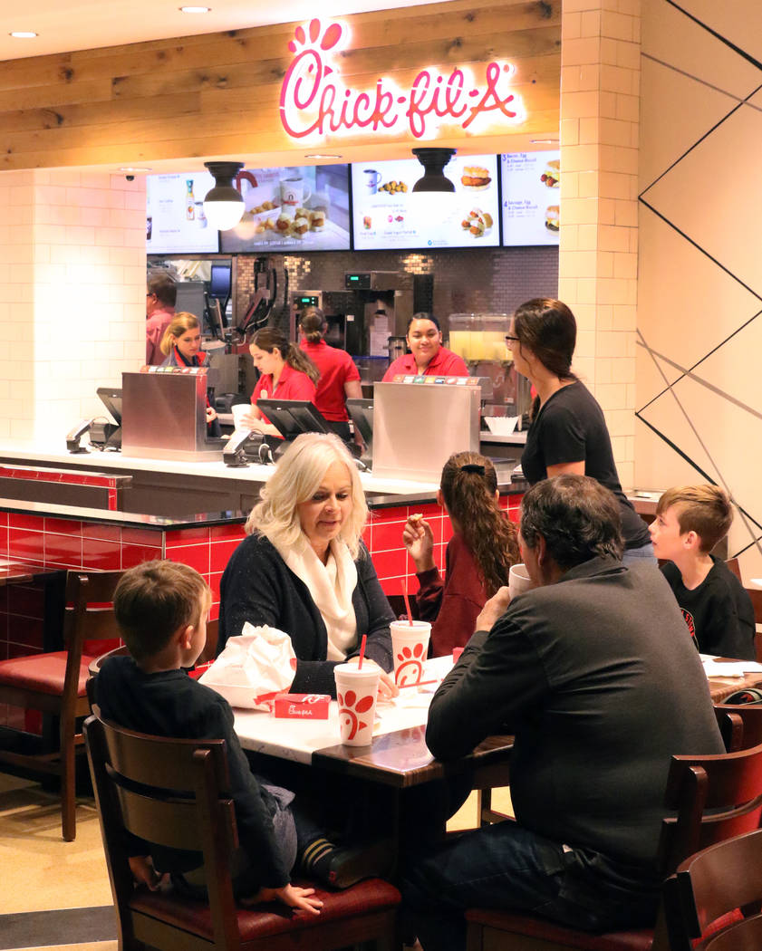 Customers enjoy their meal at the first Chick-fil-A restaurant inside the Golden Nugget on Mond ...