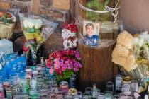 Candles burn at a memorial for Kevin Soriano, 17, of North Las Vegas, who was shot and killed S ...